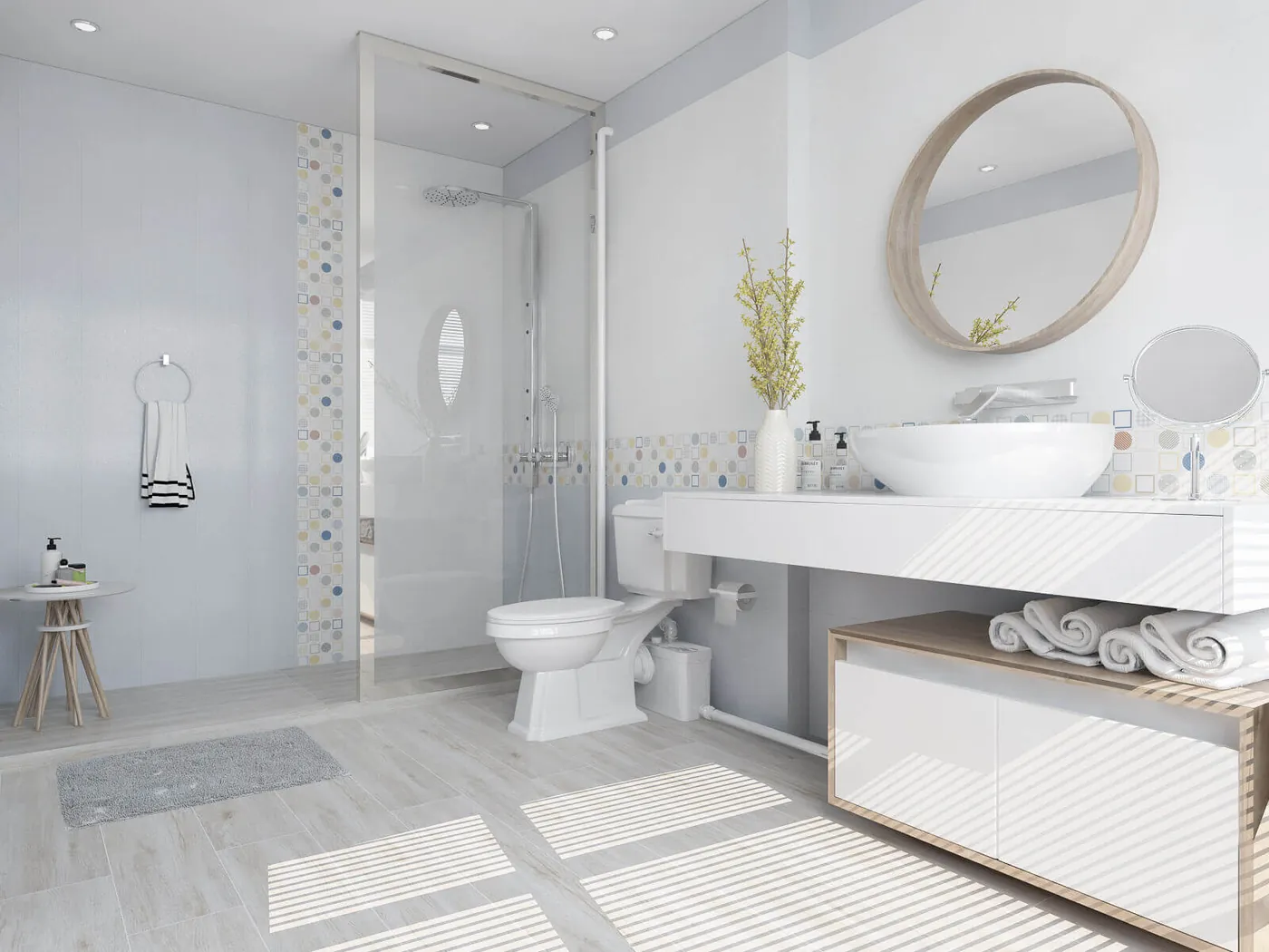 Bathroom with a wall-hung toilet, shower and washbasin, all draining through an Aquamatix macerator pump